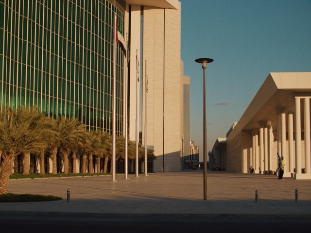 A modern government administrative building in Dubai at golden hour