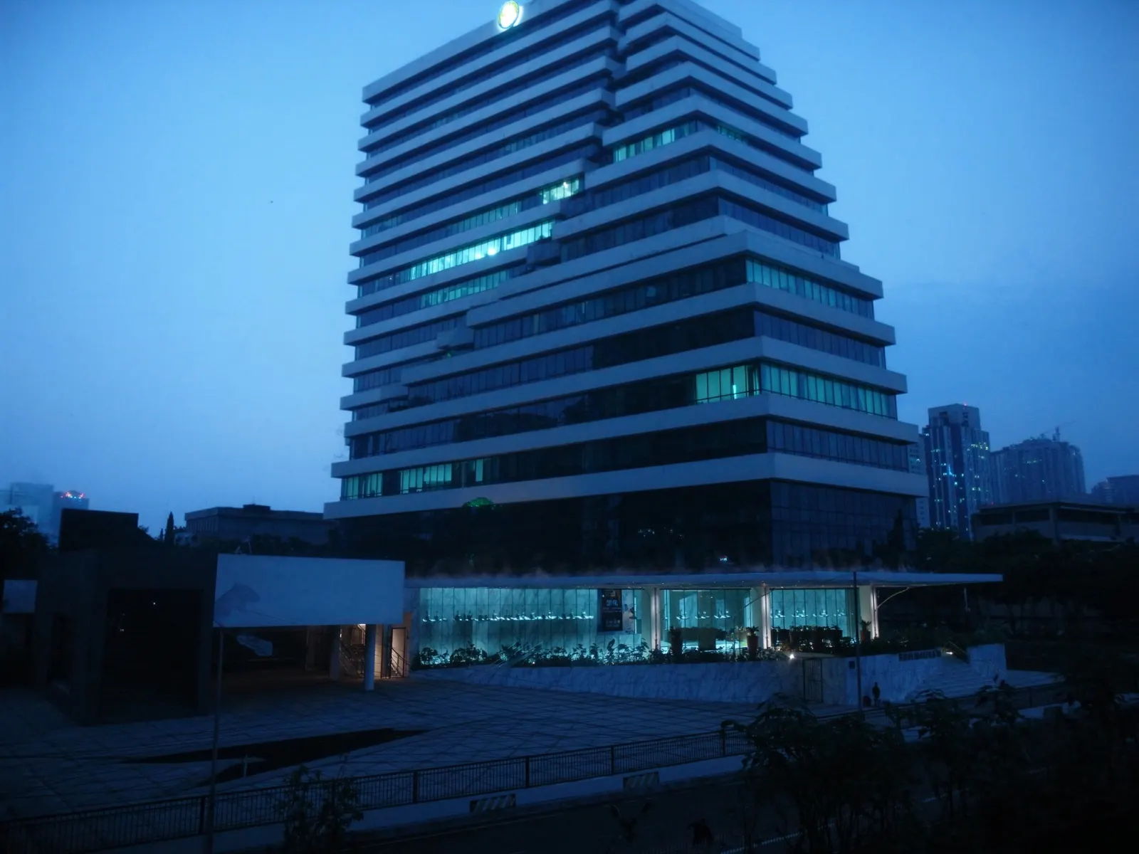 modern bank headquarters tower in Jakarta, Indonesia at blue hour