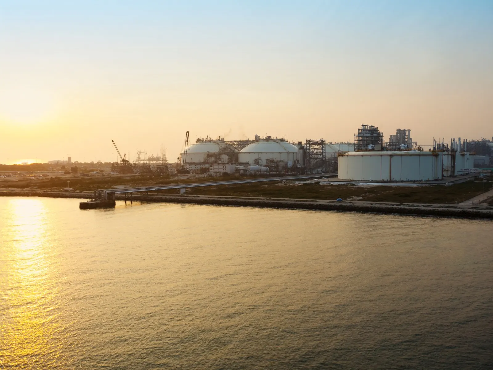LNG regasification terminal on the Indian coast at sunrise