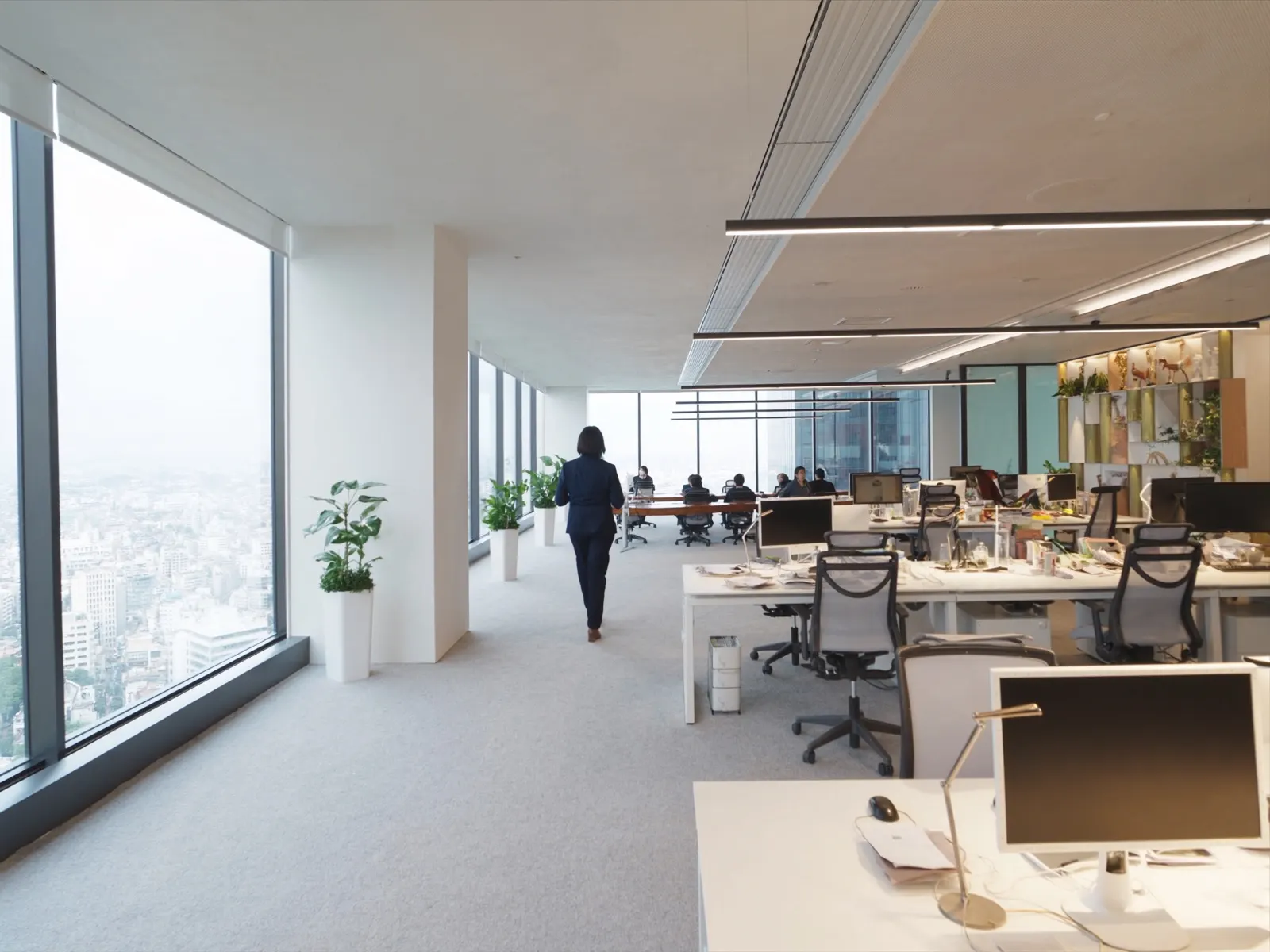 sleek Tokyo office at night seen through glass