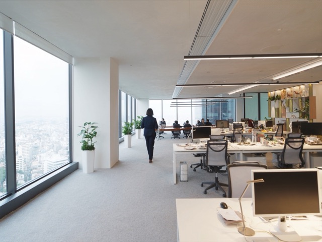 sleek Tokyo office at night seen through glass
