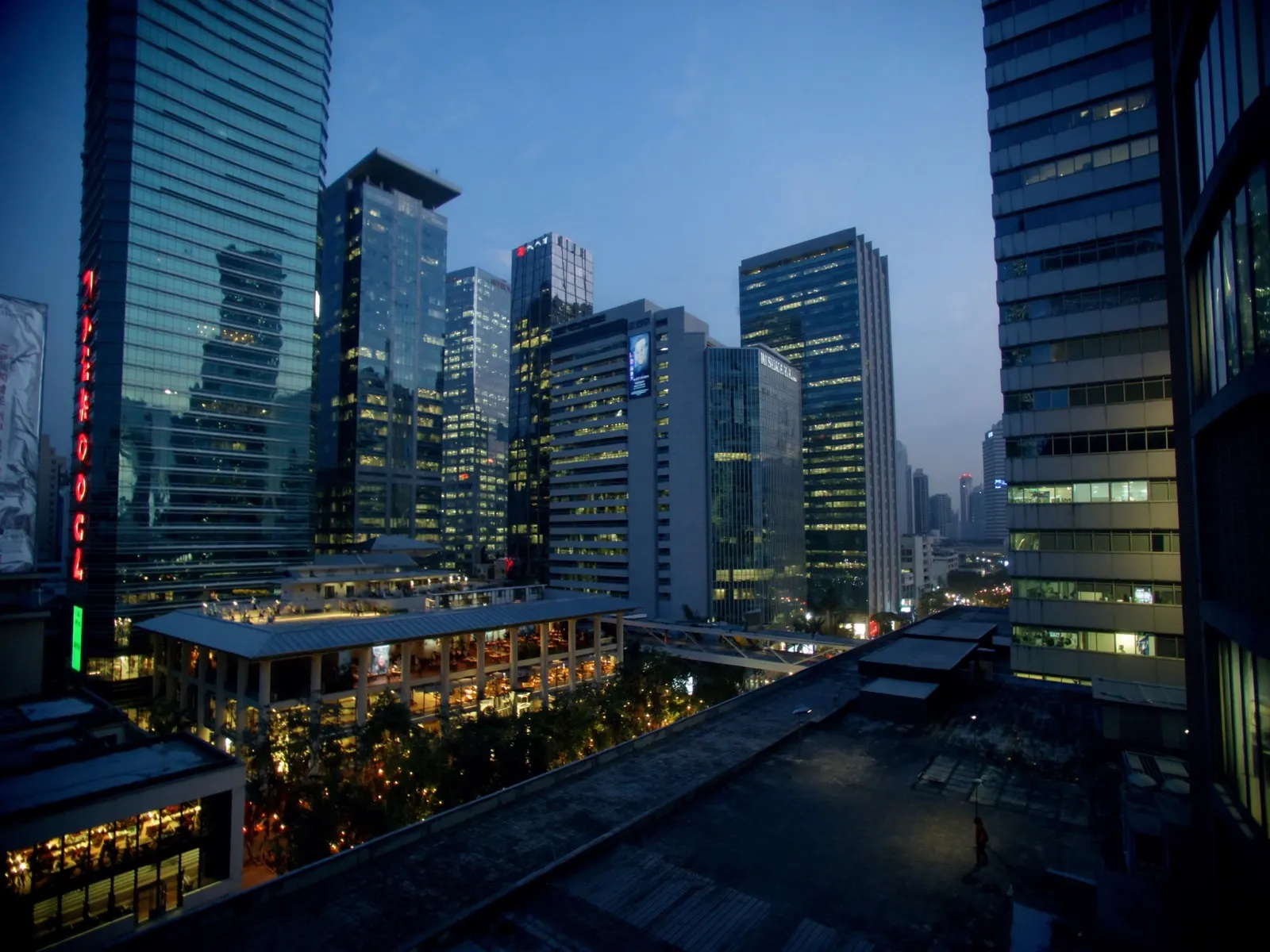 modern financial district skyline in Manila, Philippines at blue hour